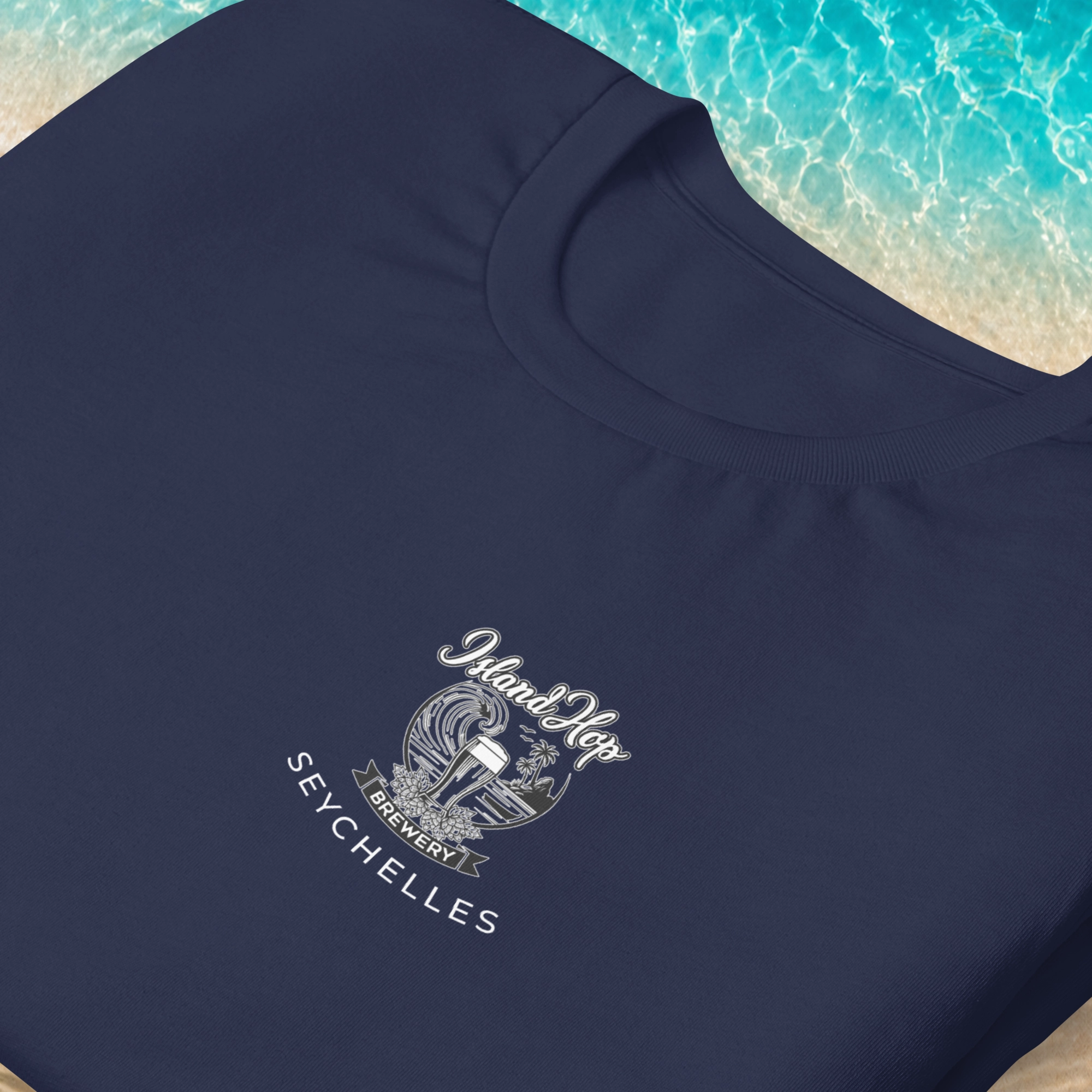 Front view of a navy Island Hop Brewery t-shirt with a small chest logo and Seychelles branding.